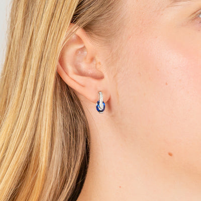 Sterling Silver Rhodium Plated Blue And White Cubic Zirconia Crossove Stud Earrings