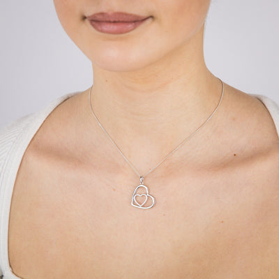 Sterling Silver Rhodium Plated Cubic Zirconia Tilted double Heart Pendant
