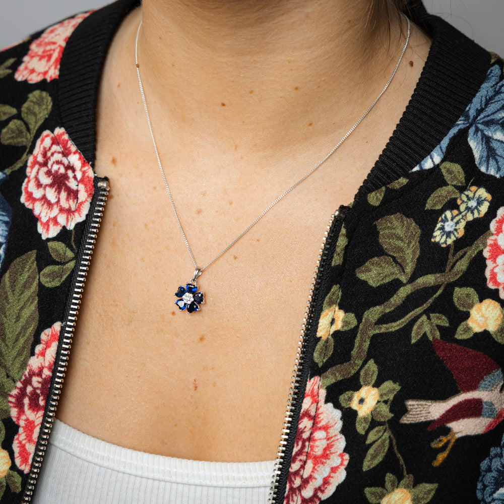 Sterling Silver Rhodium Plated White And Sapphire Blue Cubic Zirconia Flower Pendant